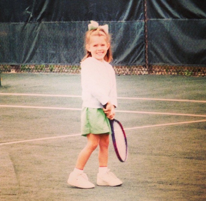 The author started playing tennis at age three and now earns extra income teaching the sport.Courtesy of Kathleen Elkins